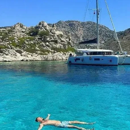 Yacht at anchor in a turquoise bay
